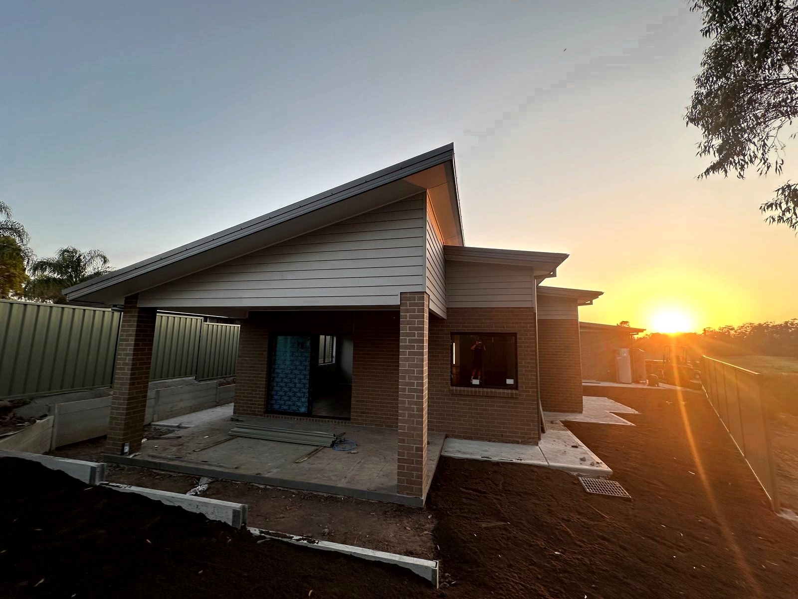 Covered outdoor area on a new home at sunset