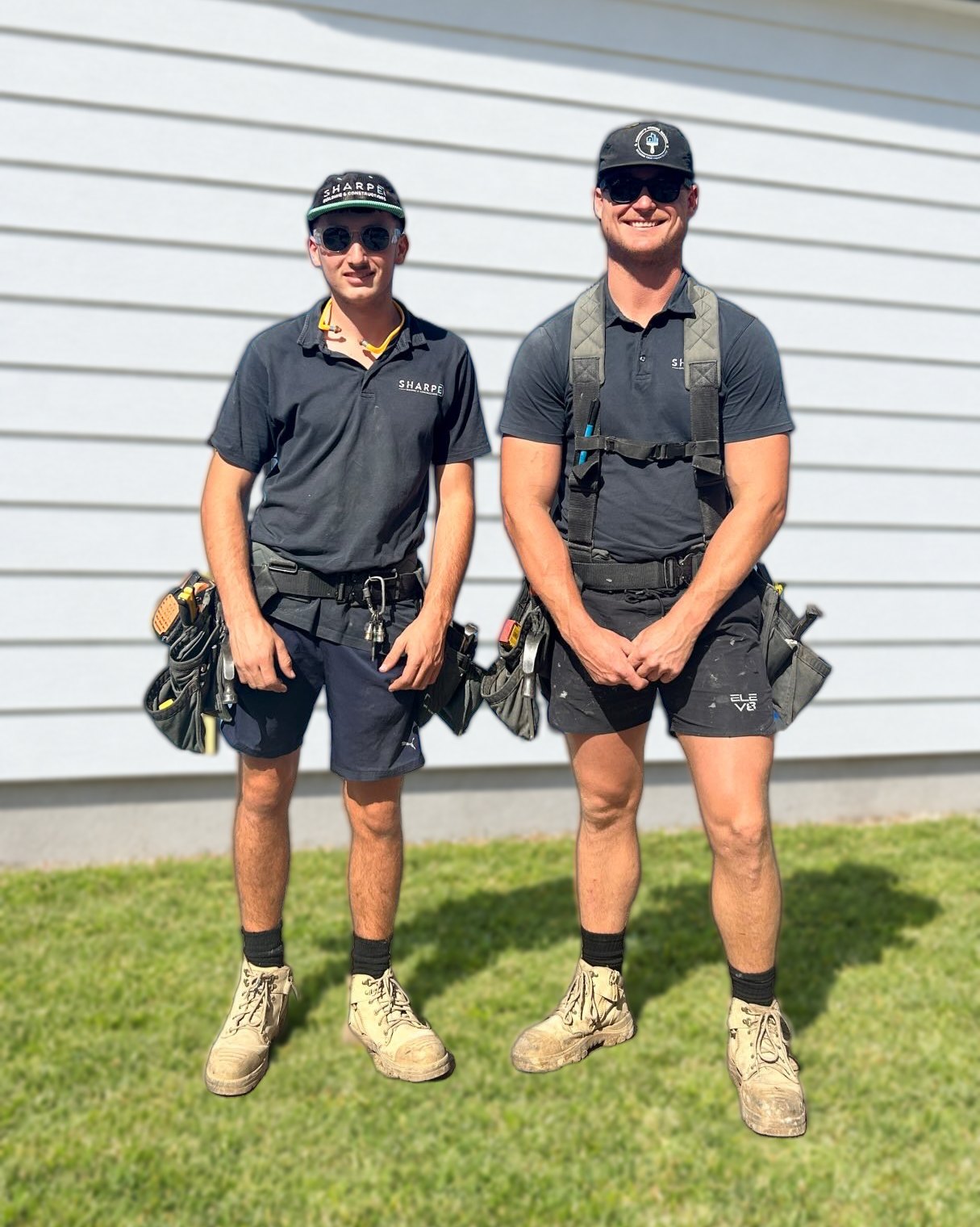 Liam Sharpe and his apprentice in Sharpe shirts and tool belts